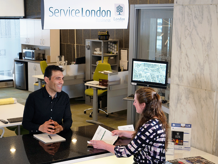 Service London Business counter interaction between two people